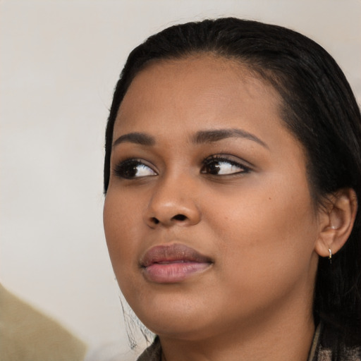 Joyful asian young-adult female with medium  black hair and brown eyes