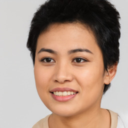 Joyful asian young-adult female with short  black hair and brown eyes