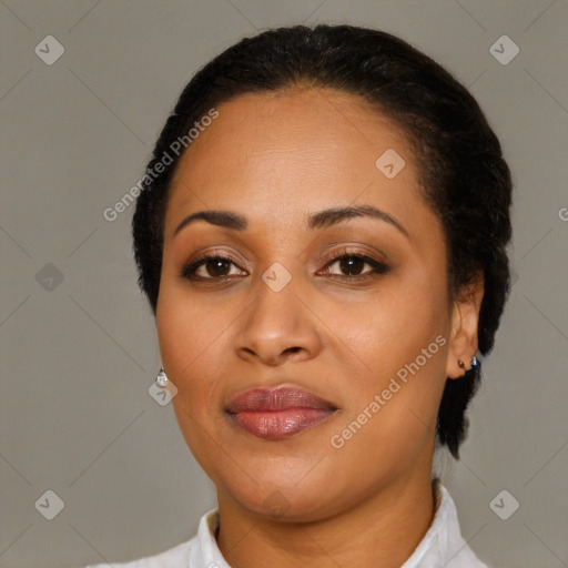 Joyful latino young-adult female with short  black hair and brown eyes