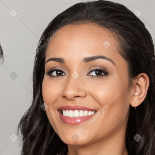 Joyful white young-adult female with long  black hair and brown eyes