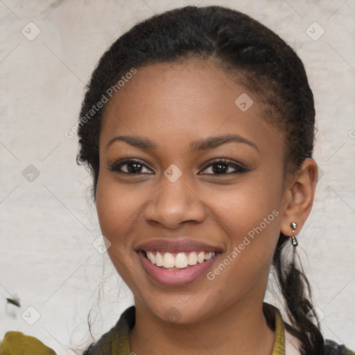 Joyful black young-adult female with medium  brown hair and brown eyes