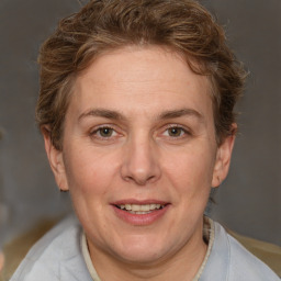 Joyful white adult female with short  brown hair and brown eyes