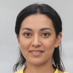 Joyful asian young-adult female with medium  brown hair and brown eyes