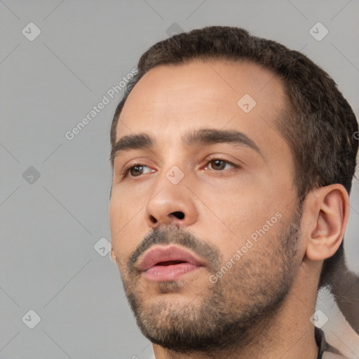 Neutral white young-adult male with short  black hair and brown eyes