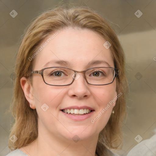 Joyful white adult female with medium  brown hair and green eyes