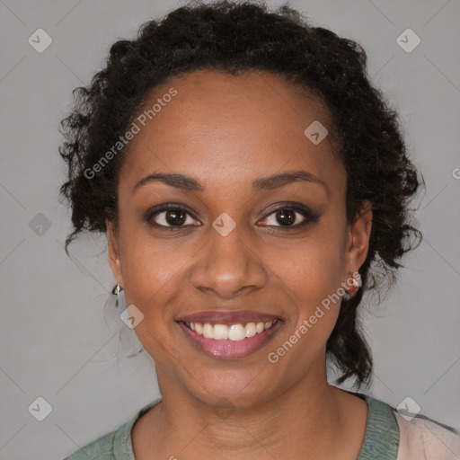 Joyful black young-adult female with medium  brown hair and brown eyes