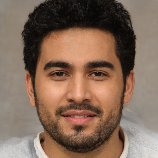 Neutral white young-adult male with short  black hair and brown eyes