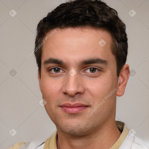 Joyful white young-adult male with short  brown hair and brown eyes