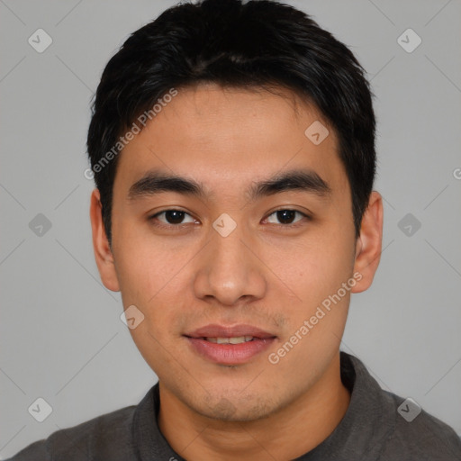 Joyful asian young-adult male with short  black hair and brown eyes