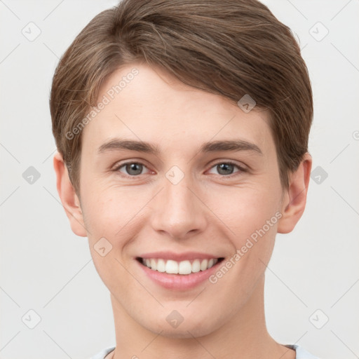 Joyful white young-adult female with short  brown hair and grey eyes