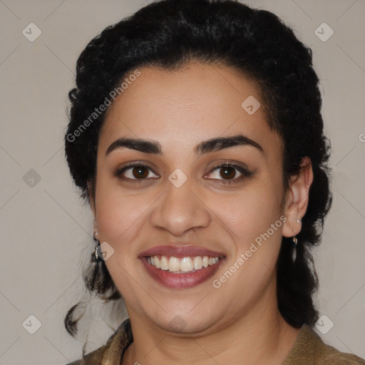 Joyful latino young-adult female with long  black hair and brown eyes