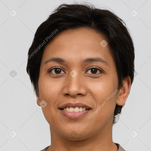 Joyful latino young-adult female with short  brown hair and brown eyes