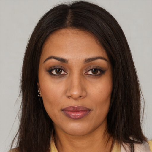 Neutral latino young-adult female with long  brown hair and brown eyes
