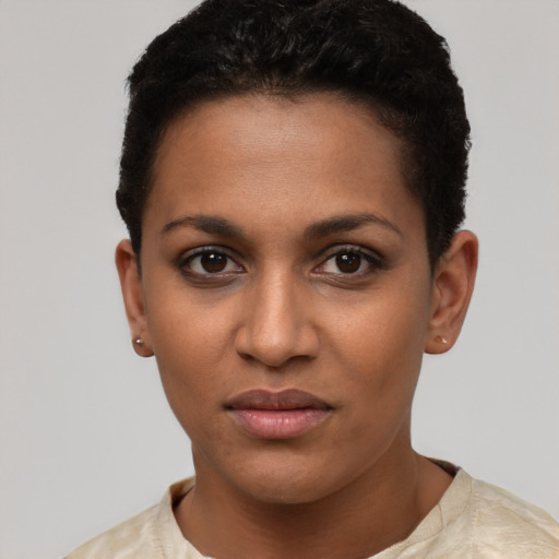 Joyful latino young-adult female with short  brown hair and brown eyes