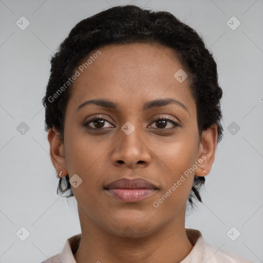 Joyful black young-adult female with short  brown hair and brown eyes