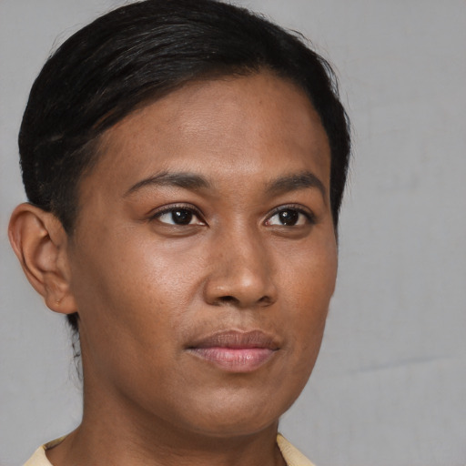 Joyful asian young-adult female with short  brown hair and brown eyes