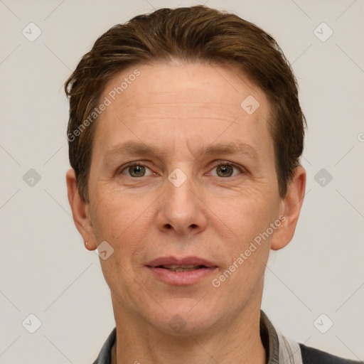 Joyful white adult male with short  brown hair and grey eyes