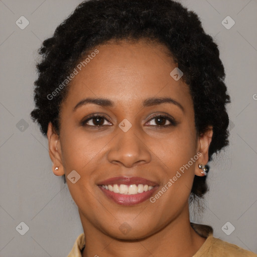 Joyful black young-adult female with short  brown hair and brown eyes