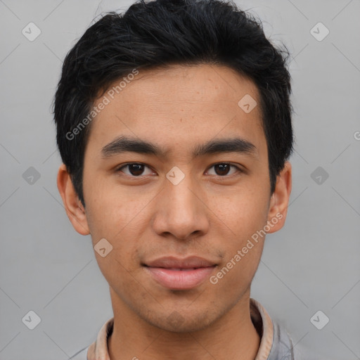 Joyful asian young-adult male with short  black hair and brown eyes