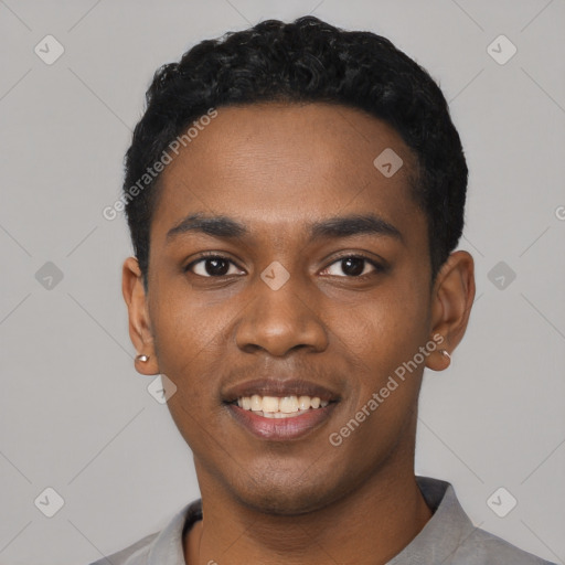 Joyful black young-adult male with short  black hair and brown eyes