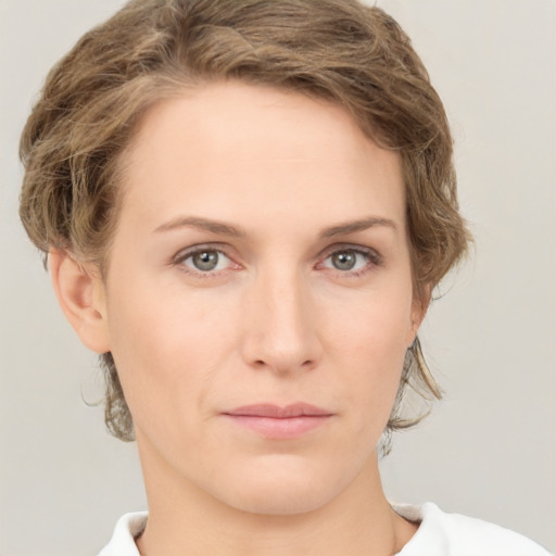 Neutral white young-adult female with medium  brown hair and green eyes