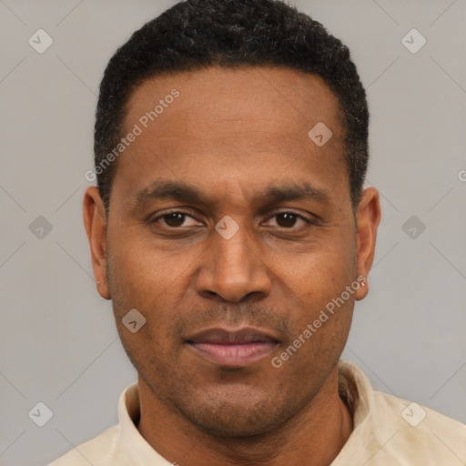 Joyful latino young-adult male with short  brown hair and brown eyes