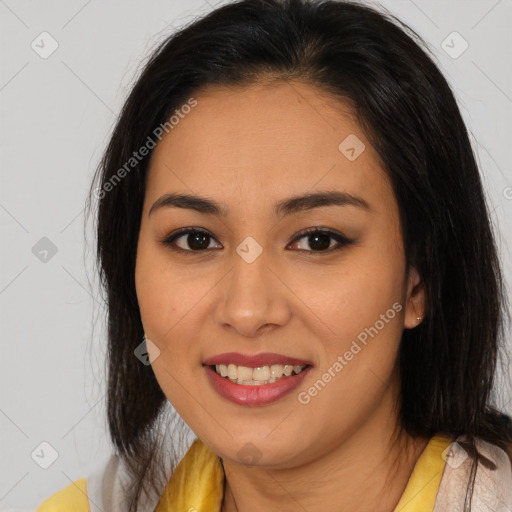 Joyful latino young-adult female with medium  brown hair and brown eyes