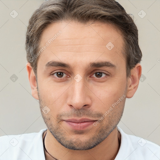 Neutral white young-adult male with short  brown hair and brown eyes