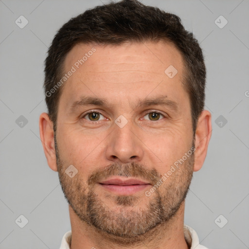 Joyful white adult male with short  brown hair and brown eyes