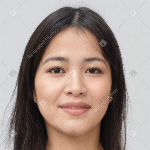 Joyful latino young-adult female with long  brown hair and brown eyes