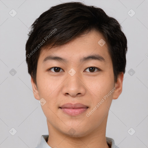 Joyful asian young-adult male with short  brown hair and brown eyes