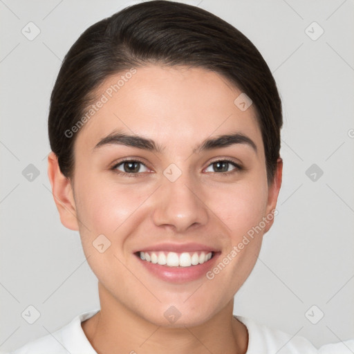 Joyful white young-adult female with short  brown hair and brown eyes