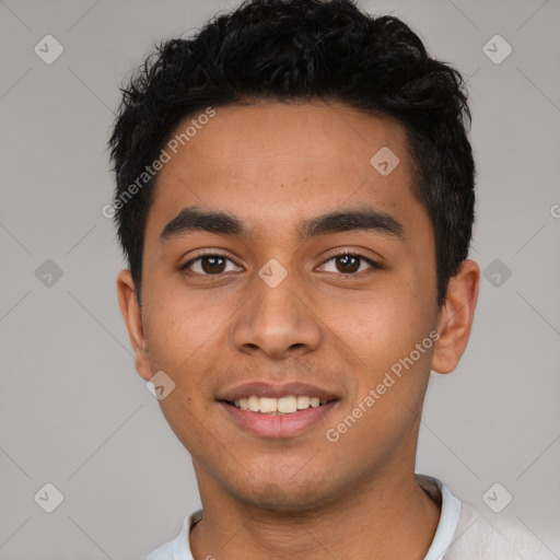 Joyful latino young-adult male with short  black hair and brown eyes