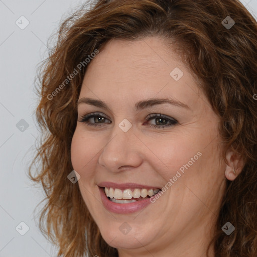 Joyful white adult female with long  brown hair and brown eyes