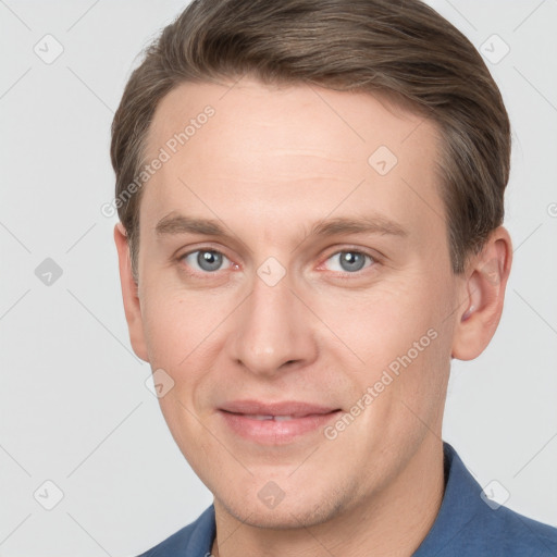 Joyful white adult male with short  brown hair and grey eyes