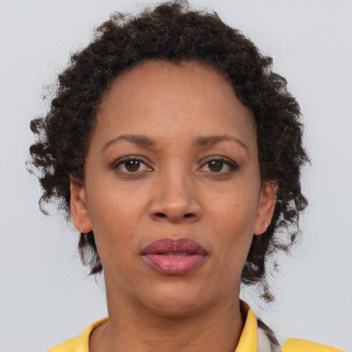 Neutral black adult female with short  brown hair and brown eyes