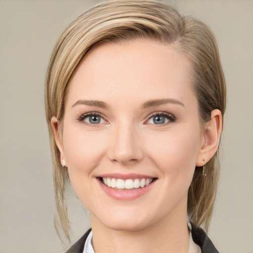 Joyful white young-adult female with medium  brown hair and blue eyes