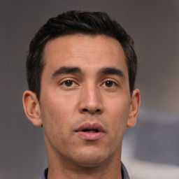 Neutral white adult male with short  black hair and brown eyes