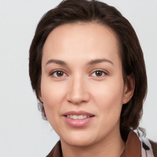 Joyful white young-adult female with medium  brown hair and brown eyes