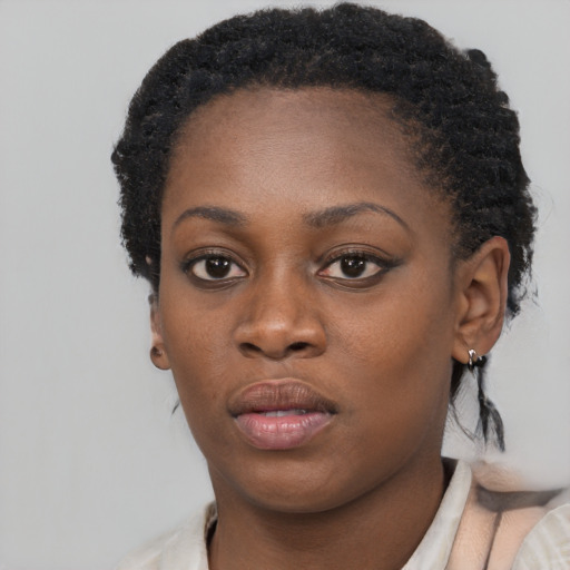 Neutral black young-adult female with short  brown hair and brown eyes
