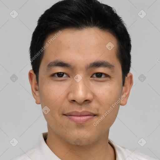 Joyful asian young-adult male with short  black hair and brown eyes