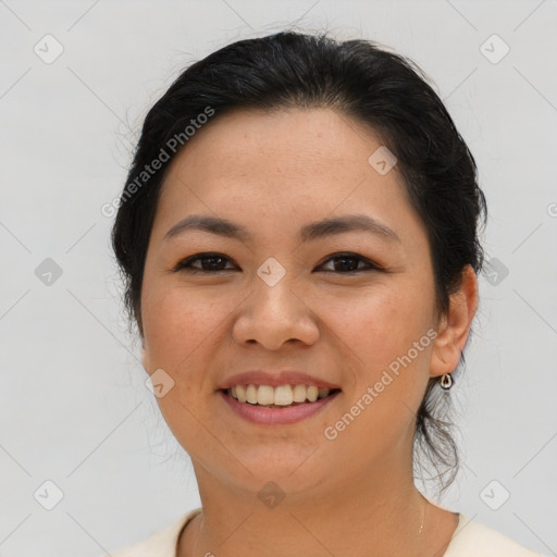 Joyful asian young-adult female with short  brown hair and brown eyes