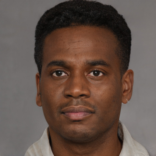 Neutral black young-adult male with short  brown hair and brown eyes