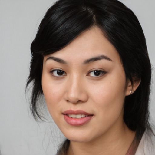 Joyful asian young-adult female with medium  black hair and brown eyes