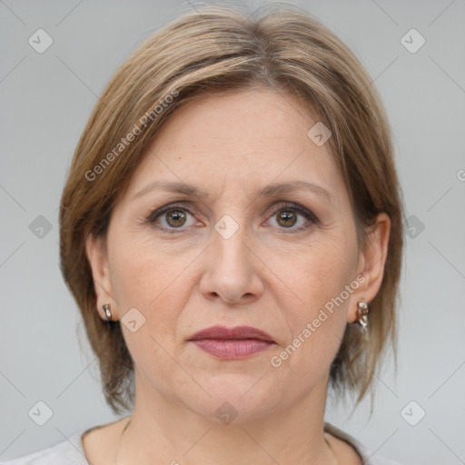 Joyful white adult female with medium  brown hair and grey eyes