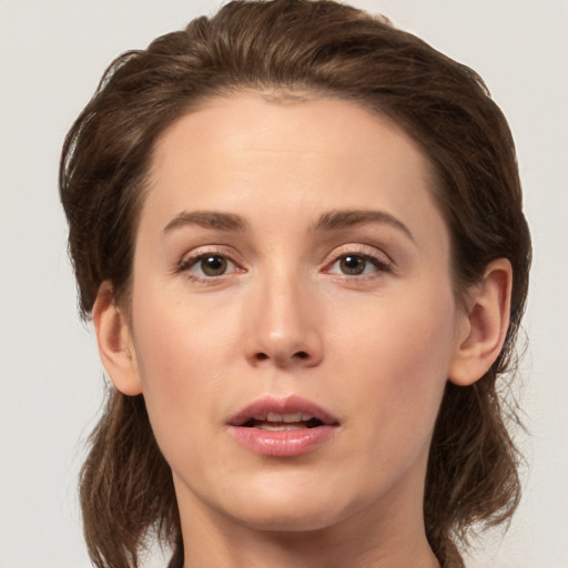 Neutral white young-adult female with medium  brown hair and brown eyes