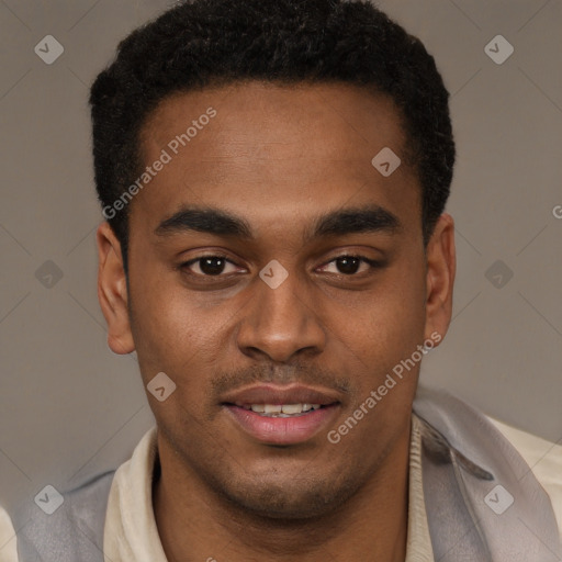 Joyful black young-adult male with short  brown hair and brown eyes