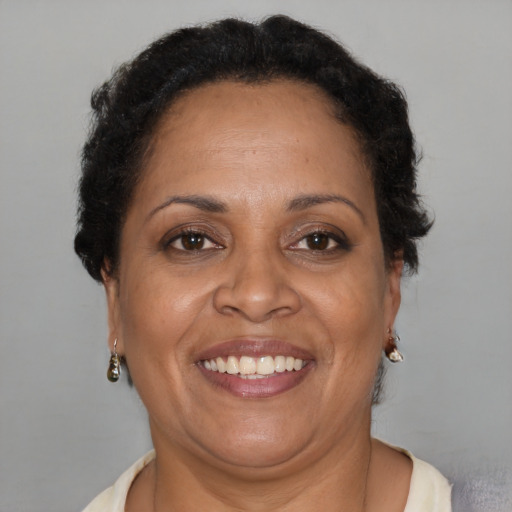 Joyful latino adult female with short  brown hair and brown eyes