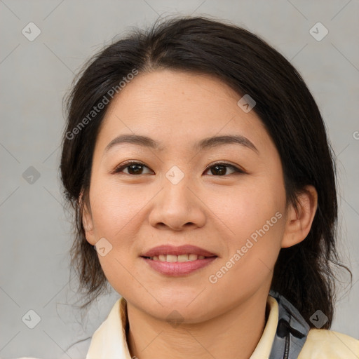 Joyful asian young-adult female with medium  brown hair and brown eyes