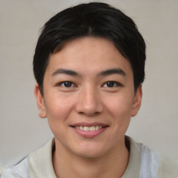 Joyful asian young-adult male with short  black hair and brown eyes